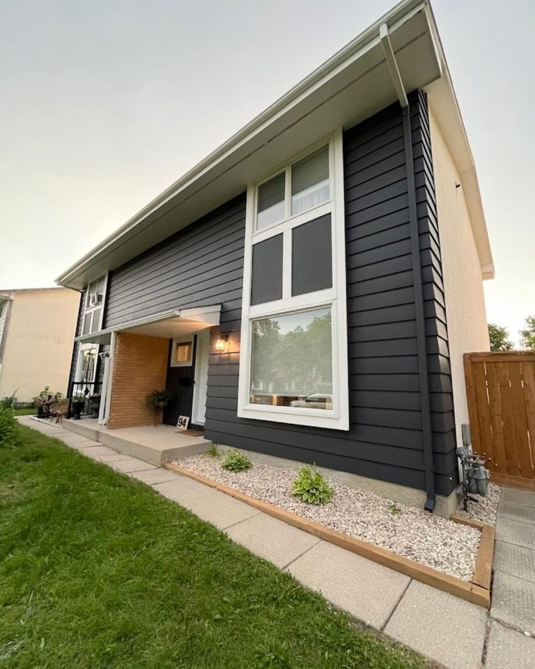 Dark Blue House with White Trims on Windows